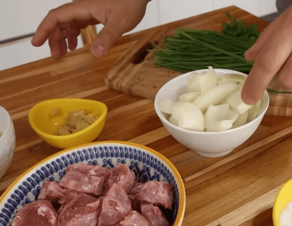 Traditional Brazilian feijão tropeiro served with collard greens
