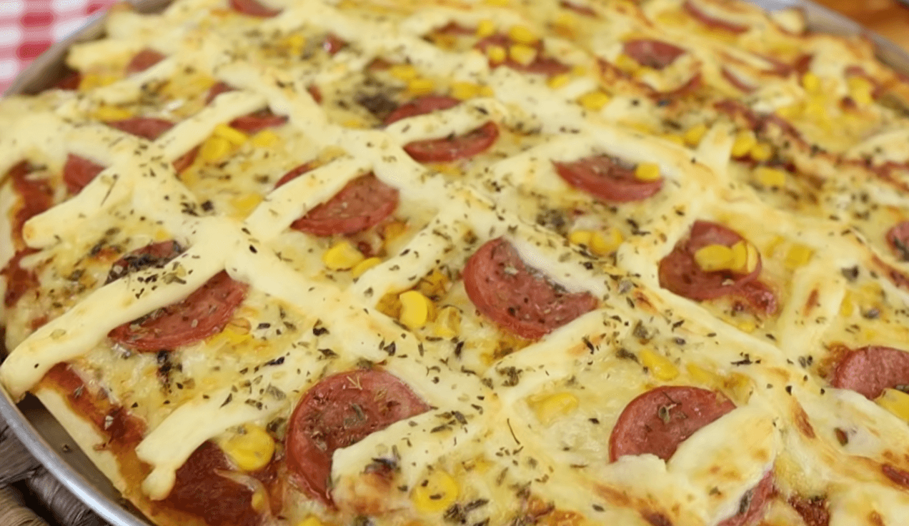 Text: homemade blender pizza with melted cheese and toppings