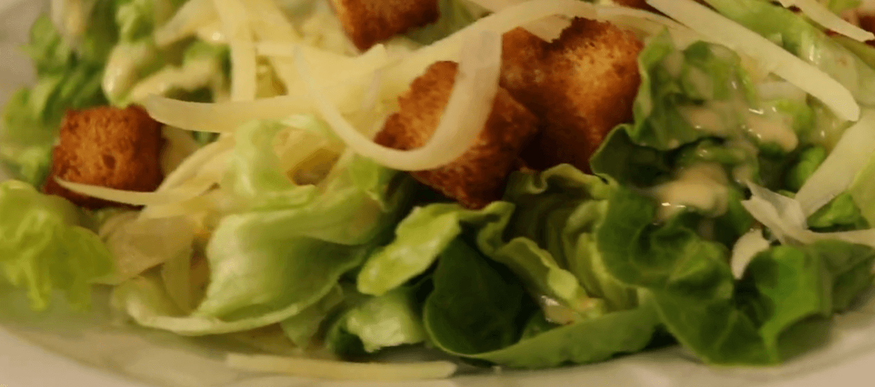 Classic Caesar salad with romaine lettuce, croutons and creamy dressing
