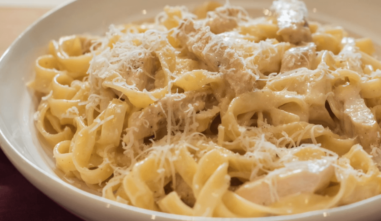 Creamy chicken alfredo pasta with grilled chicken and parmesan cheese
